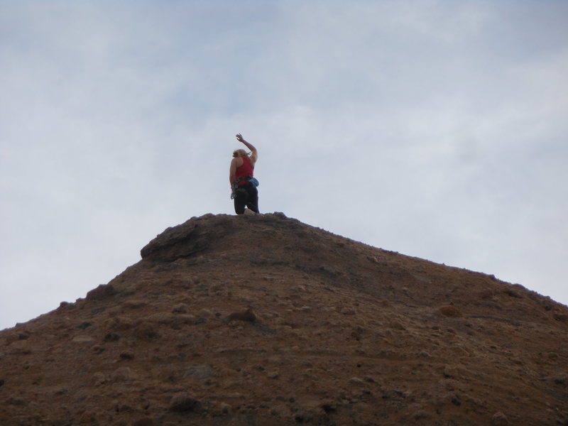 Jubilant climber enjoying the summit of the Tower of Babel.