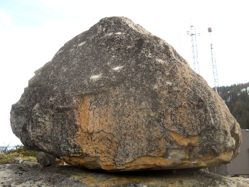 The northwest side of the Antennae 2 boulder. V2 mantel in the center and V0 arete on the right.