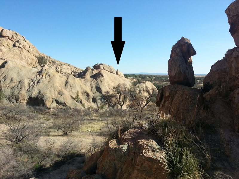 Arrow shows location of bolted routes as you head into valley behind Sweet rock
