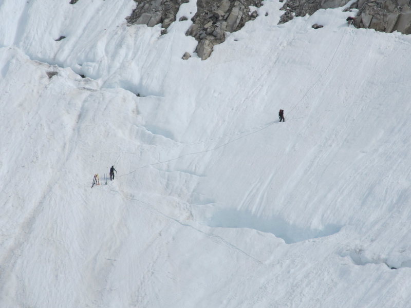 Craig Peterson, Rob Litsenberger, and Marcin Ksok negotiate the bergschrund.