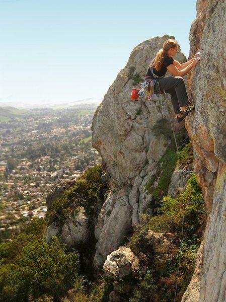 brett hanging on to the jug above the roof. lookin pretty casual at a massive slab whipper onto some hopefully solid gear