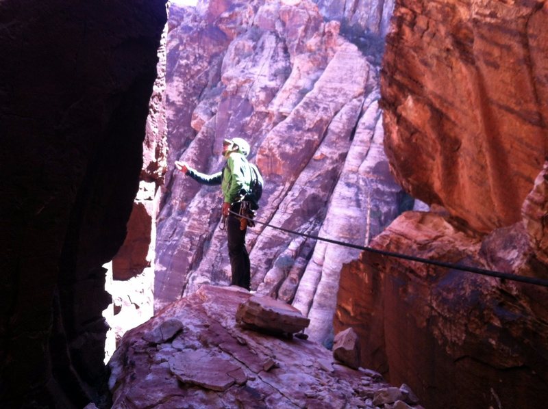 Contemplating the moves off the chockstone to start pitch two, during the FA.