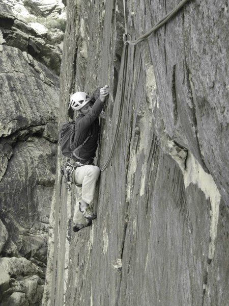 Thin traverse beneath headwall and towards the top of Pitch 2.