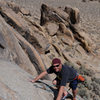 A climber from San Diego nears the anchor atop Rhythm on the Range, in the Alabama Hills.