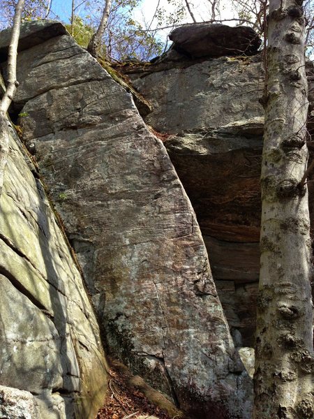 The obvious right hand leaning arete.