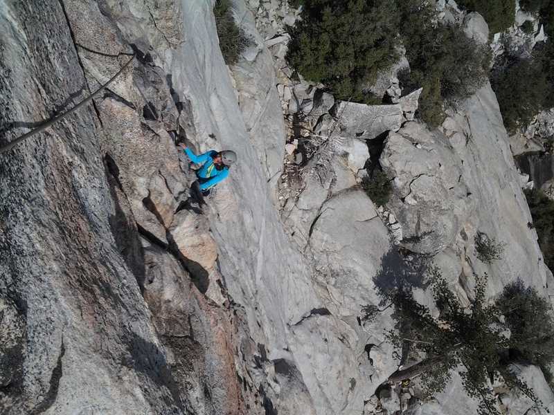 Heading up to the first belay on Left Ski Track. It's an exposed jug haul with a single fixed pin and a large crack (Left Ski Track) that you can use for supplemental pro. Careful with rope drag if you protect the bottom of the route.