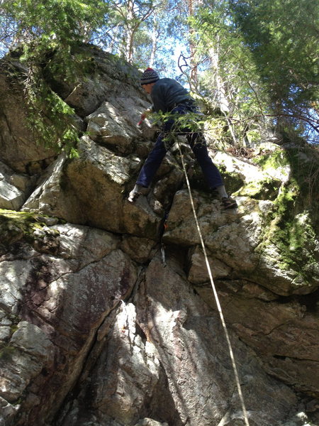 Cleaning off holds in preparation of the First Ascent of Café Americano
