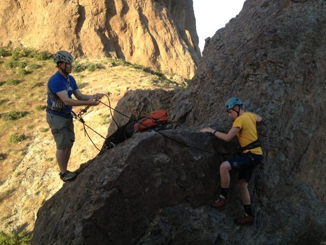 bringing coda up to the first belay ledge.