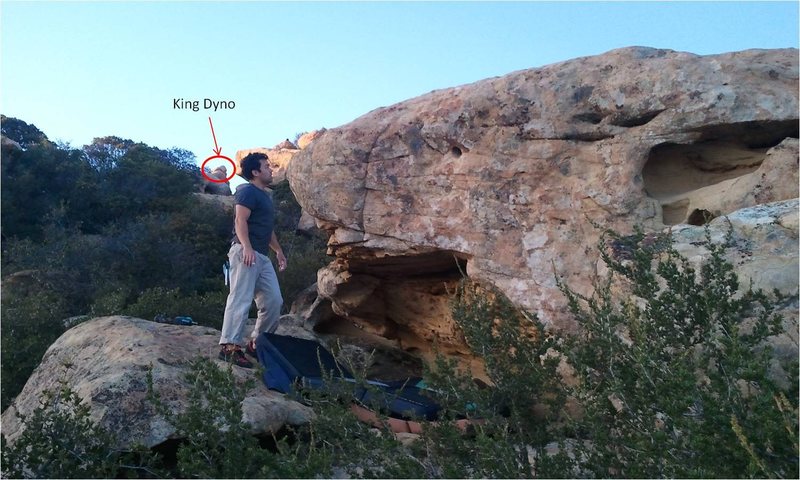 Sit start on good holds on the right side of the cave, move up to the big pocket, match, and throw to some pretty good slopers at the top.