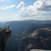 Adam standing on the "The Visor" at the Half Dome summit after climbing Snake Dike, April 24, 2013
