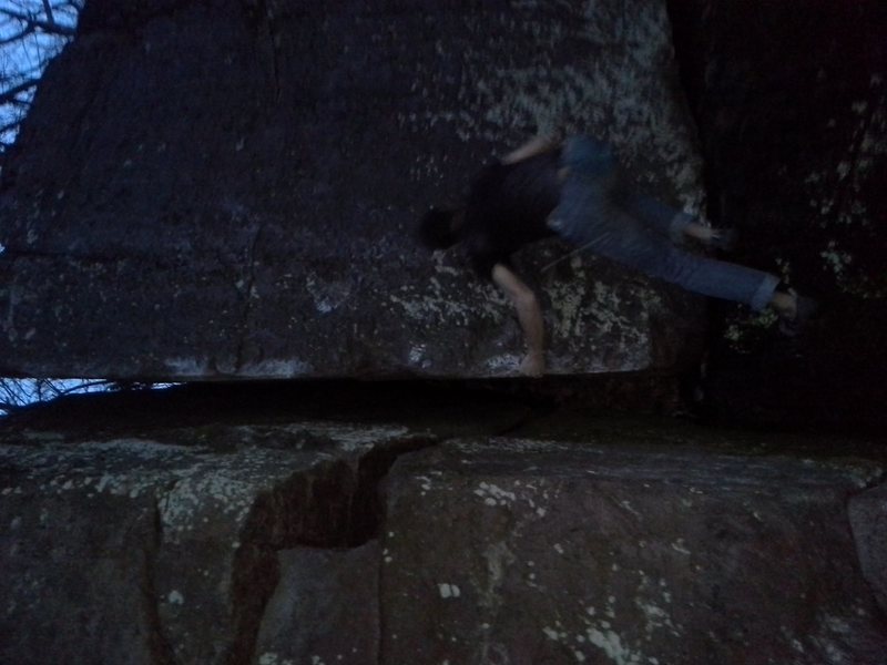 Clayton Groth making first few easy moves. Left hand on Arete right hand on undercling on the lower part of the face.