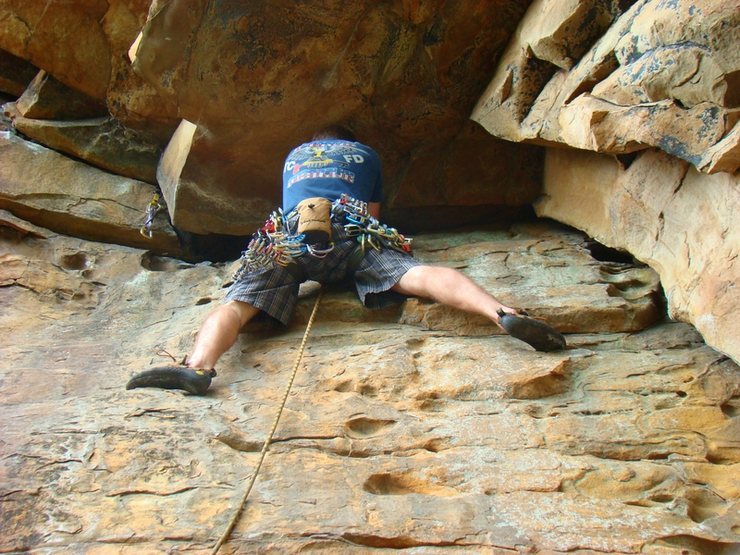 Me just about to clip my first piece at the 1st roof of Optimus Prime. It is tempting to place lower and to the right, however that will drastically increase your rope drag.