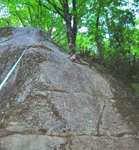 Climber toproping Weed-be-gone (10b). The upper part of A Touch too Much (11b) crosses the image in the upper left. (Photo from RCNW.net)
