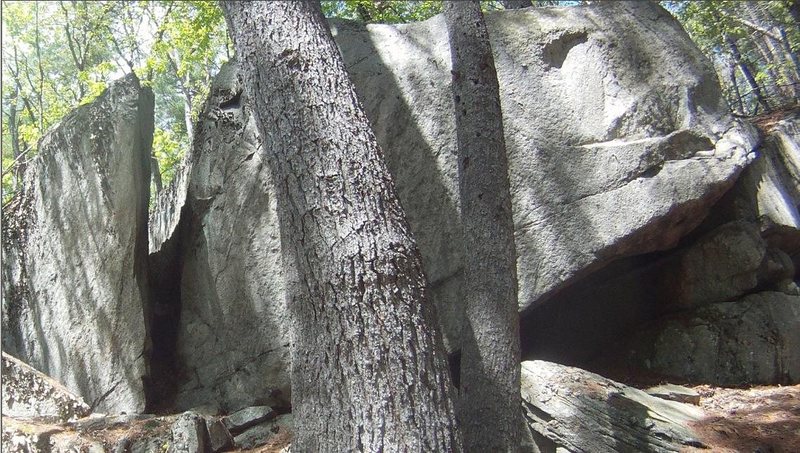 Chimney Boulder close-up. Sign says 'Porcupine Habitat'. This boulder is on Autumn Hills Farms property. They have nice, marked hiking trails through here. This is on trail named Chimney Route.