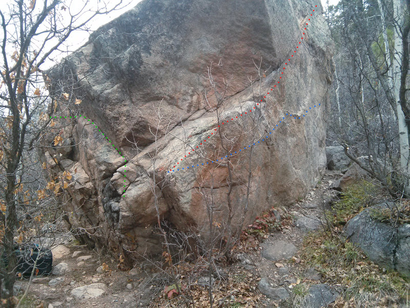 Patrol Boulder. Green: V0 traverse side facing the road. Red: V1 high traverse from the ramp into a finger tips seam. Blue: V5 low traverse.