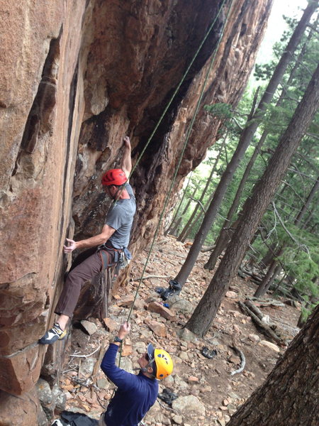 Me working a short cruxy top rope problem (probably 11+) just left of Reef on It, in Tan Corridor.