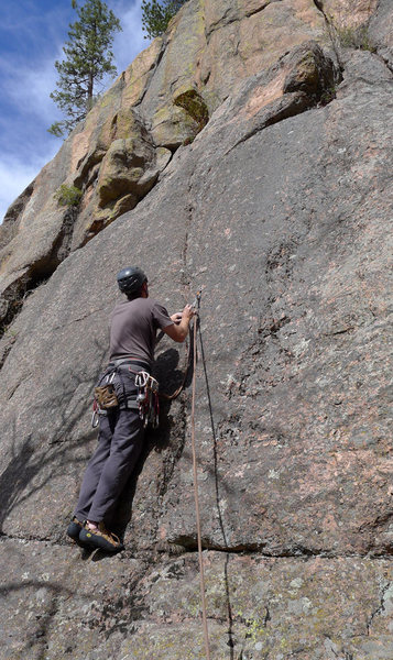 Climber starting up Crystal Corner.