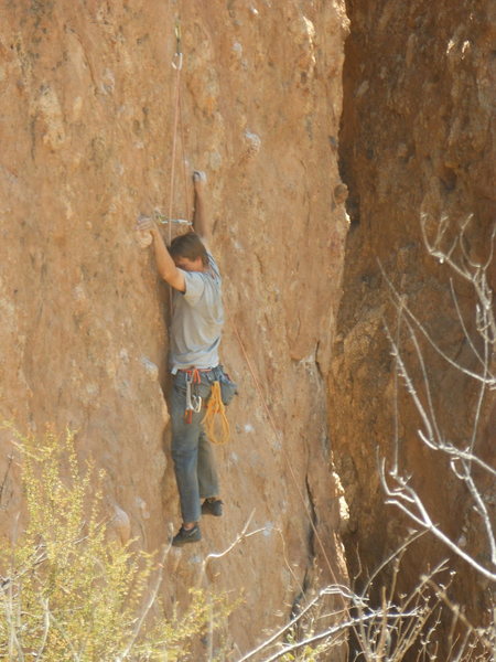 A climber working the line on the left or the east wall of Corvus Crack.