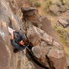 Dr. Pete Yeo snakes his was through the crux hold