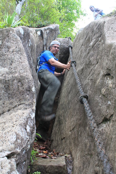 Chimney #1. If you trust the ropes, this is 4th class. If you don't trust them, and your feet are dry, it is a 5th class chimney. If your feet are muddy, it is a 5.15b