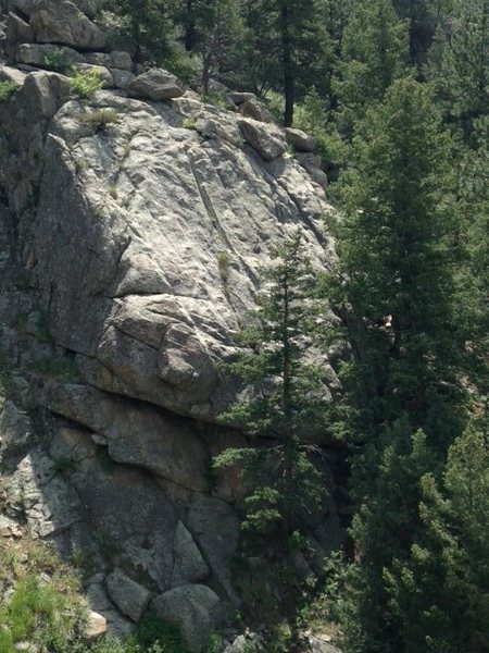 Allen's Arete Crack follows the sun and shadow line on the left side of this photo (more or less). It avoids the big overhangs at the bottom by skirting left.