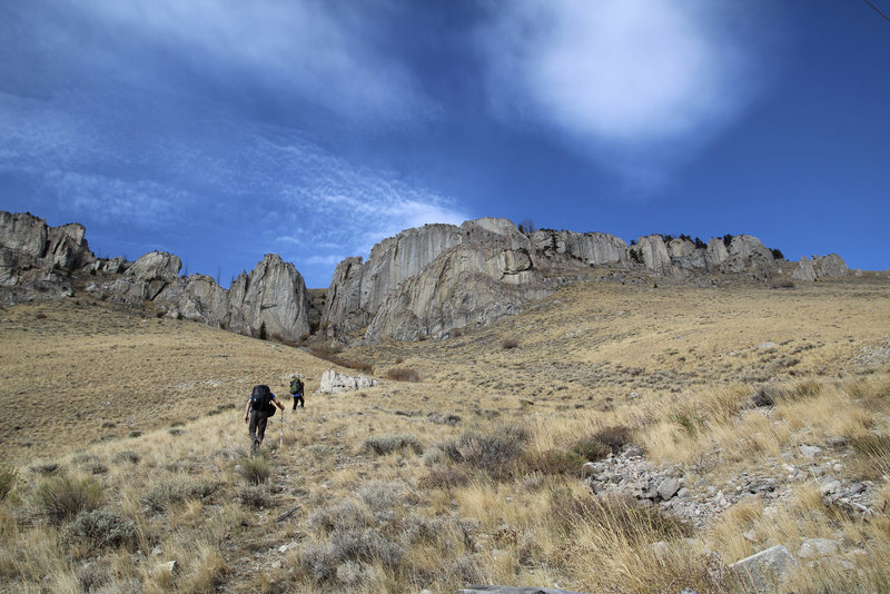Approach from the Lower Parking. Yellow Cake is the "tooth" on the left of the drainage and the Discovery Wall is on the right. Try to find the trail and stick to it.