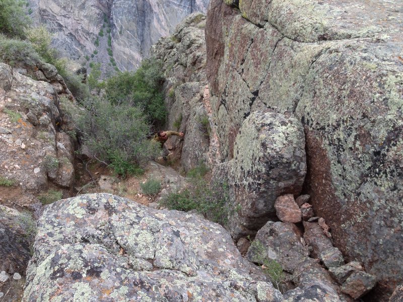 This is the gully you must scramble down about 70 feet. You can not see the anchor. Go past this to scope.
