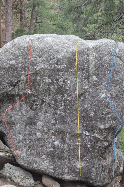 Boulder 4 with routes a, b, and c. (red, yellow, blue) yellow was the only one i attempted and was really enjoyable with good movement on pretty positive holds. the top out is high up and pretty blank so i didn't manage the send, opening moves felt around v2/v3. the other routes on this boulder look hard.