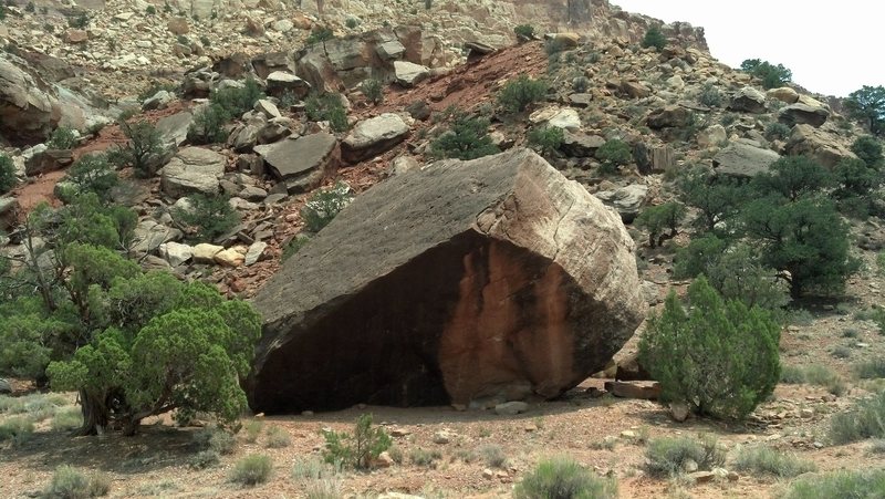 Everett Ruess Memorial Boulder from the road. Downclimb to the left. Routes on the opposite side are much steeper