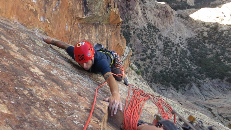 Reaching for the much needed belay "ledge" in the Red Dihedrals.
