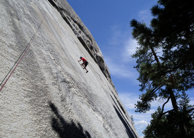 Doug Steigerwald is past the crux and cruising on the Good Samaritan (5.11+) at Dome Rock. <br>
<br>
The first 80 feet of this route are protected by 4 buttonheads--most mortals will want to lead Red Mushrooms and then enjoy this incredible climb on top rope.