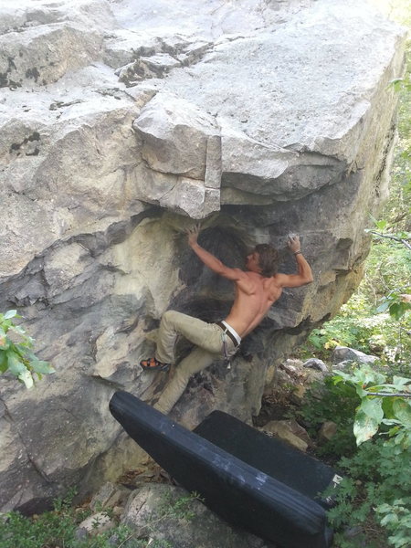 Kevin getting the first ascent on Compressed Leprechaun