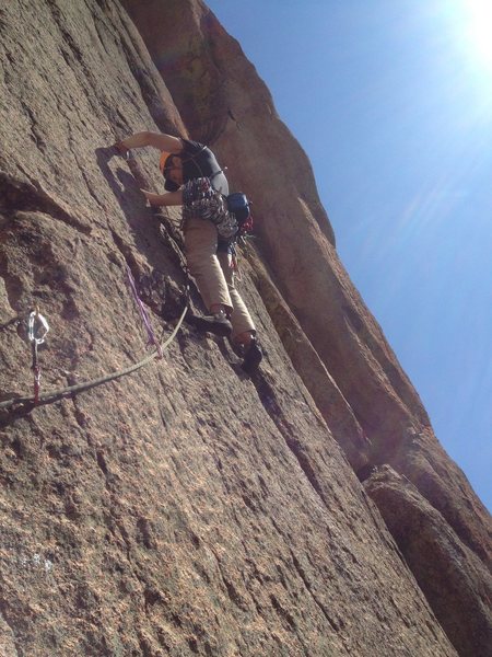 Just past the 1st traverse on the start of P2. I think this would be a better choice for the P1 belay.