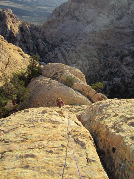Looking down the first pitch just as the sun comes up. Nowhere in the world we'd rather be. The Maze is in the shadowed canyon below the route--looks like a place orcs would live.