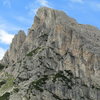 Hexenstein from slopes above the Falzarego Pass. Under maximum magnification, climbers may be seen on the large terrace.