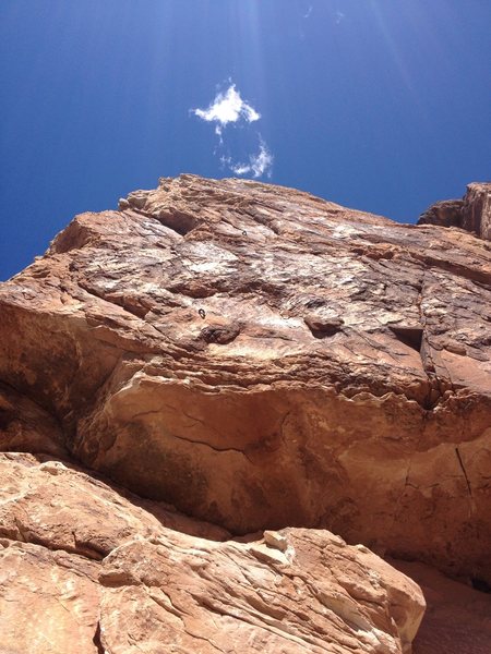 First bolt on Impotence can be seen just above small overhang. Undercling in crack to left under ledge for safe/easy clip.