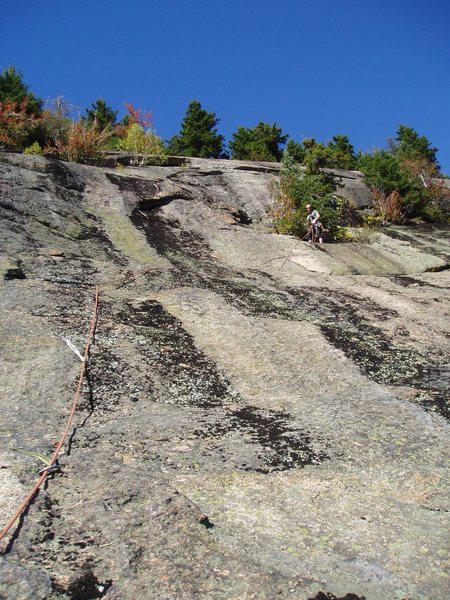 Sir Bors Dream-Top of P1, looking at P2 (slab above and left of belayer, leading to overlap)