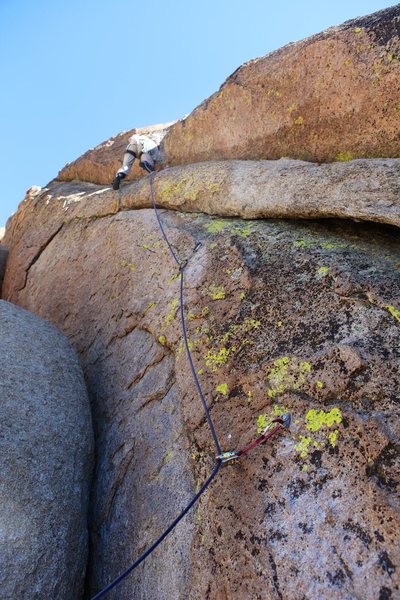 Approaching the step up onto the slabby face on the first ascent.