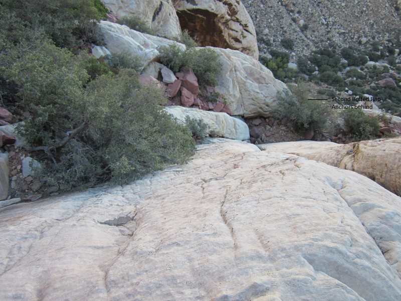 Looking down at a little down scrambling to get to the second bolted rap station.