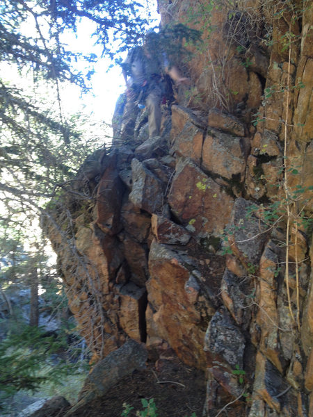 This is the slightly exposed walk off for the Ranch Hand. Hand and footholds are abundant. 4th class.