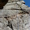 It looks like most people ascend the crack to the right of the rope.  Darren Mabe shows the climb further to the right.