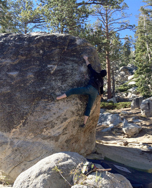 Making the crux bump at full extension.
