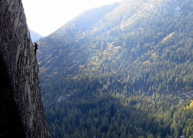 A climber on P3 of Traveler Buttress. Afternoon in October. View from Central Wall. <br>
<br>
Photo: Corey Gargano