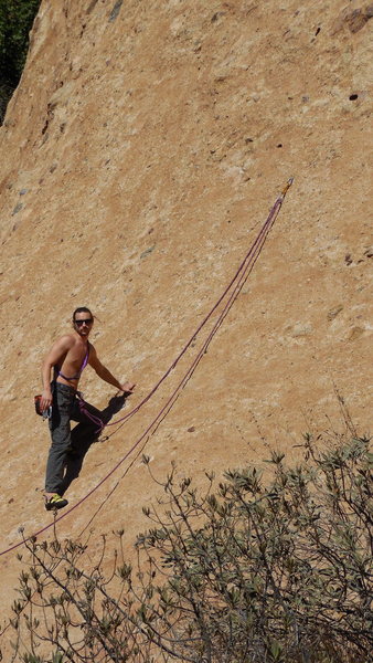 An experienced climber using the 1st bolt and the lower slab of "Hyperion" to demonstrate footwork and give their new partner practice belaying.