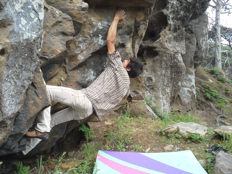 A short line I spotted on the Arete left of Jugular. Seems to go about V3. Tops out on the wall, around some vegetation.