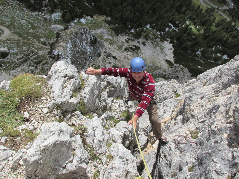 Stemming the chimney/gully on lead four.