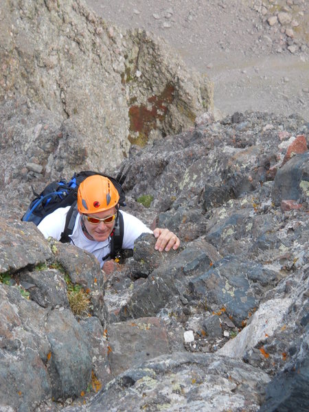 George Wilkey topping out on the 4th class pitch just below thw summit of Crestone Needle.