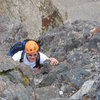 George Wilkey topping out on the 4th class pitch just below thw summit of Crestone Needle.