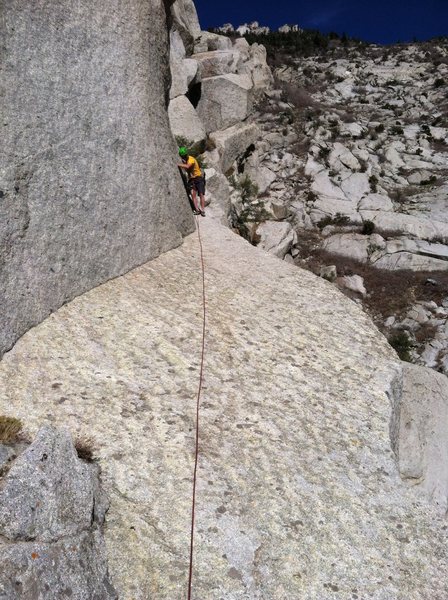 The big sloping exposed traverse ledge from wild things to the flakes. It's only maybe half a rope length between the 2 climbs