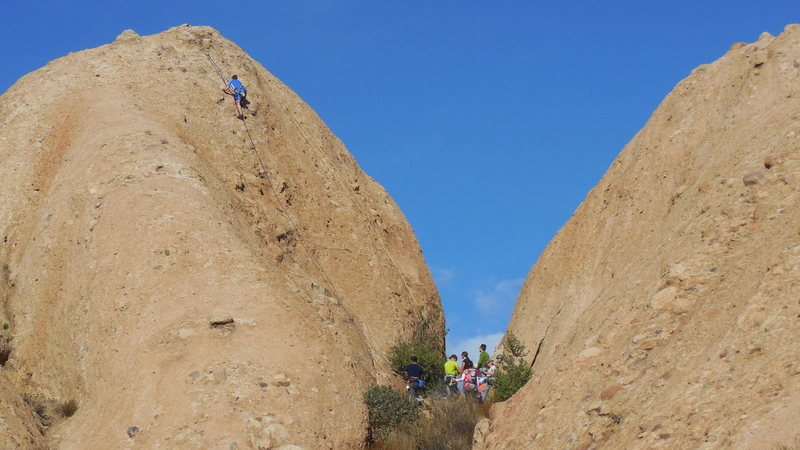 A crowd offering moral support for a climber on "Cracker Jacks."